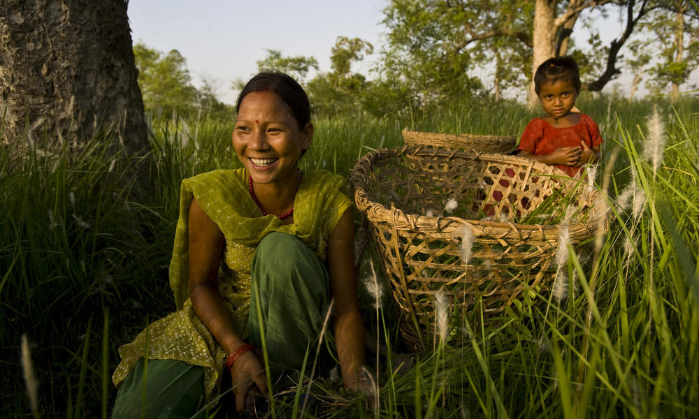 Women in Nepal tending to the grasses