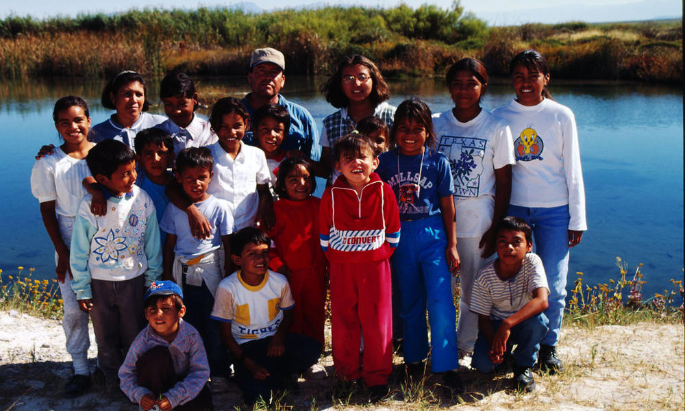 Children from one of the (Ejidos) communal farms visit Cuatrocienigas wetland pools to learn about their local environment Chihuahua Desert, Mexico