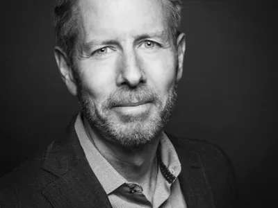 A headshot of John E. Morton
