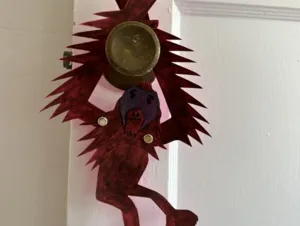 Arts and crafts verion of a swinging orangutan