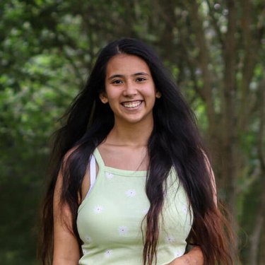 A woman smiling at the camera.