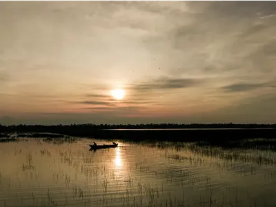 Boat on a lake at sunrise
