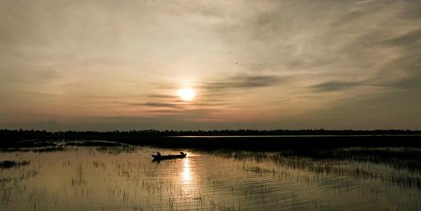 Boat on a lake at sunrise