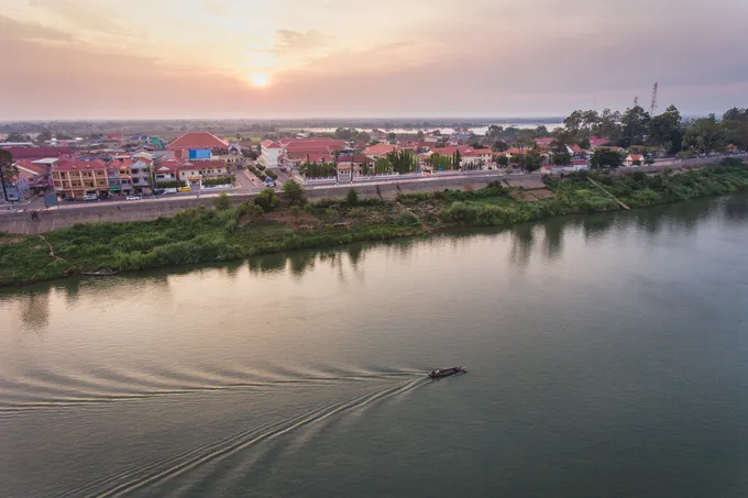 Aerial image of boat on Mekong a dawn