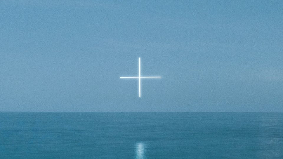 Still ocean landscape with plus sign