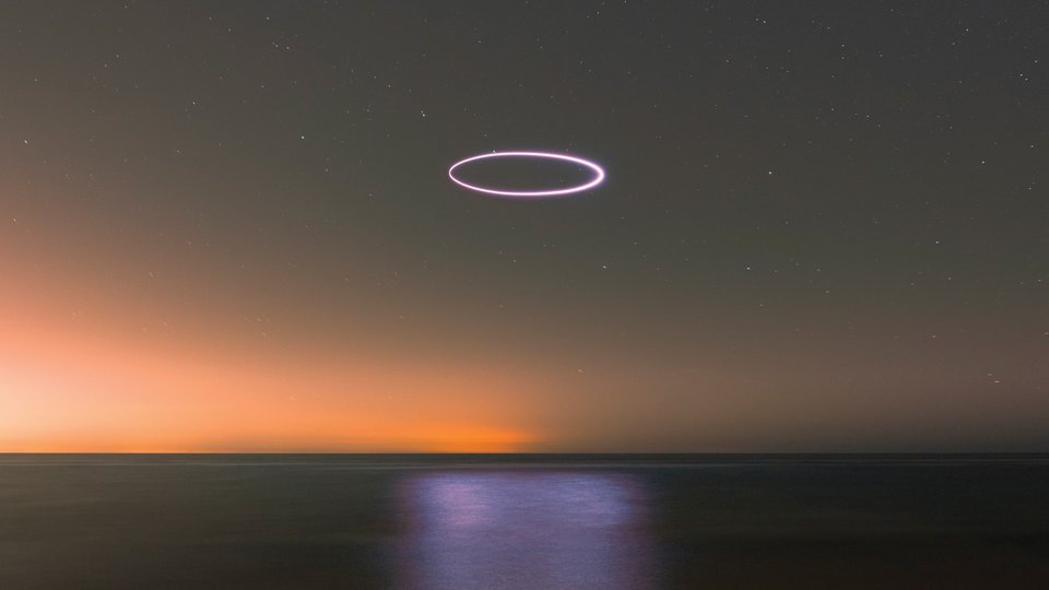 Oval over sunset ocean