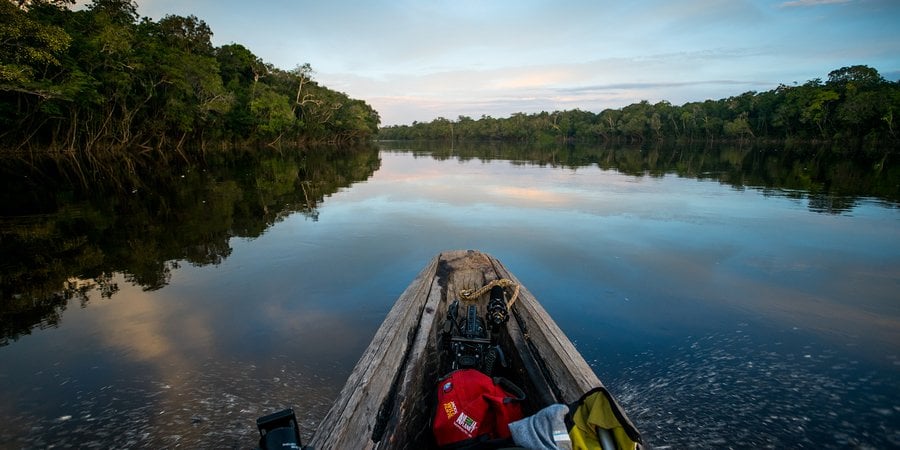 Prow of a boat traveling down a river