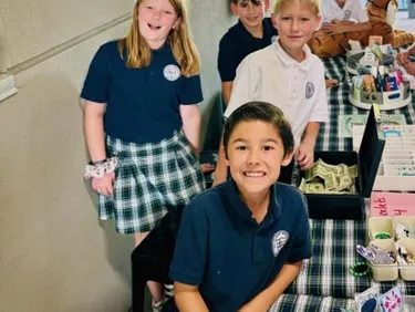 Kids at a table in school