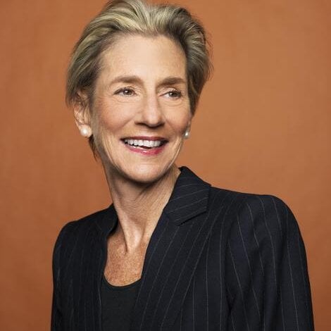 A professional portrait of a woman wearing black.
