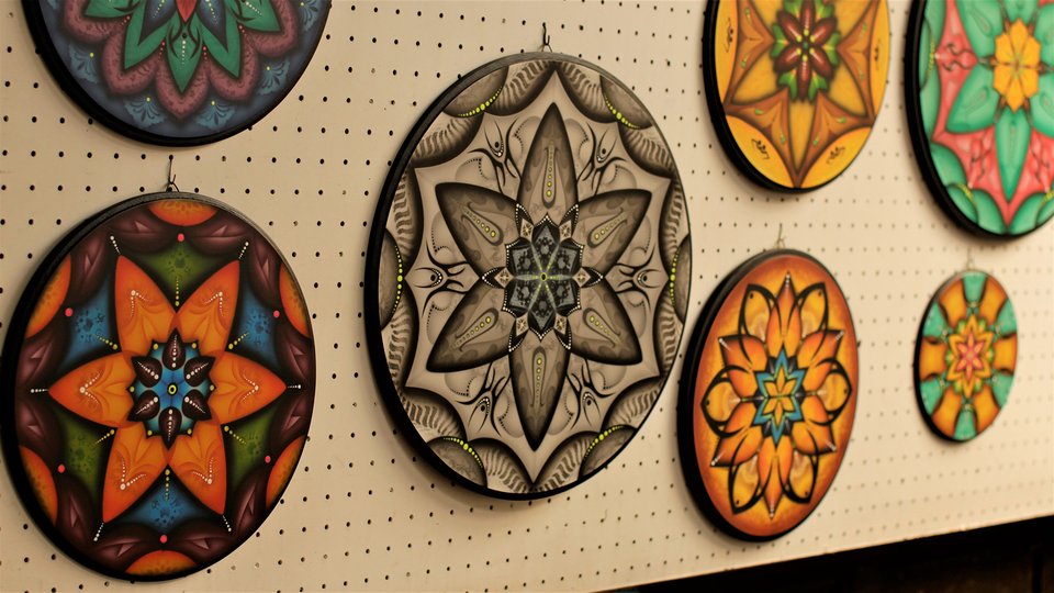 Multi-colored round decorations hanging on a wall