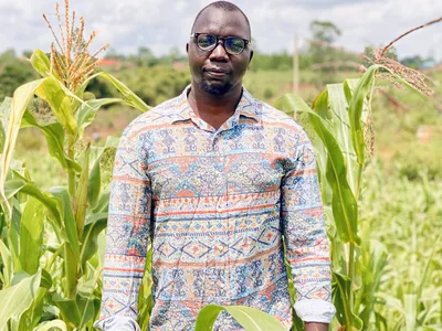 a headshot of Amos Amanubo in a field