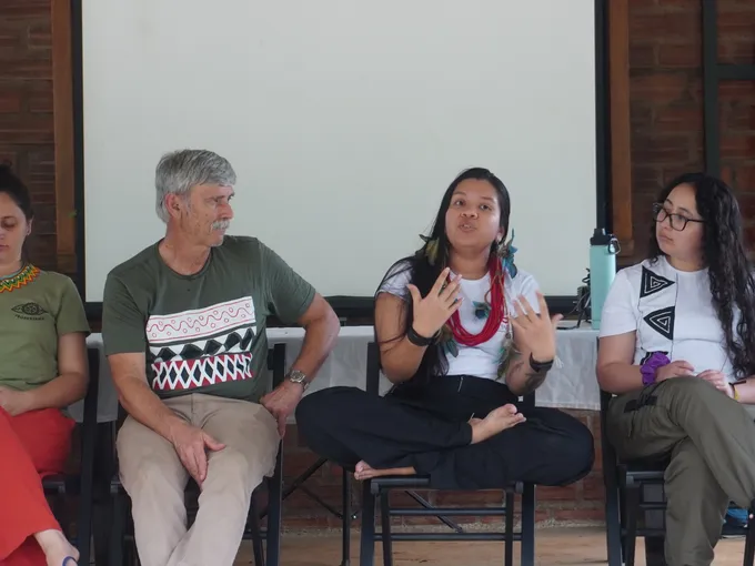 WWF's Chris Weaver, second from left, sits at a workshop with members of the Indigenous Paiter Surui community and other WWF staff
