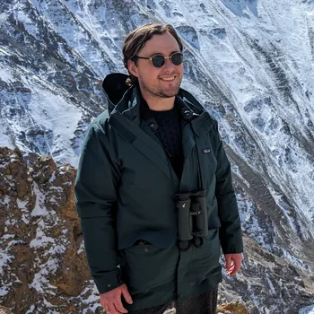 Daniel Hornett standing on a mountaintop