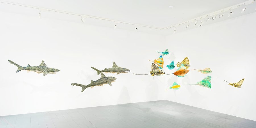 Sculptures floating in gallery