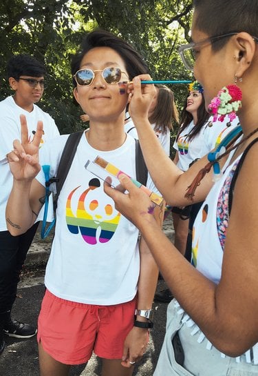 Grace Lee holding up 2-finger peace sign