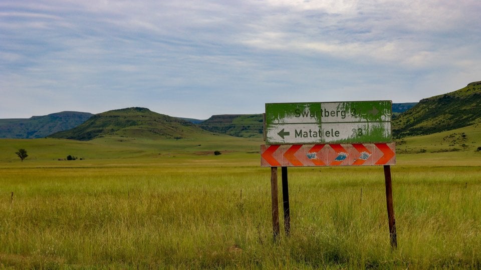 A signpost in the South African countryside directs to Swartberg and Matatiele