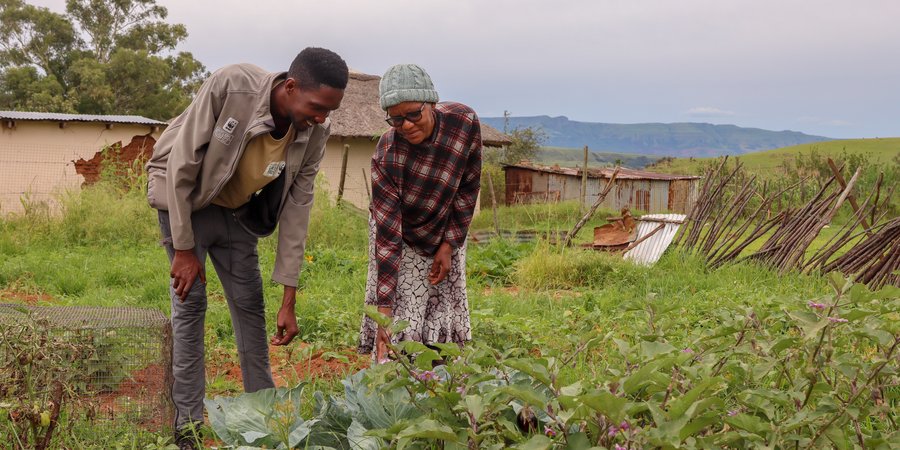 Tukulo “TK” Mtshayelo and his mother inside their garden in Black Diamond Village, Matatiele, South Africa