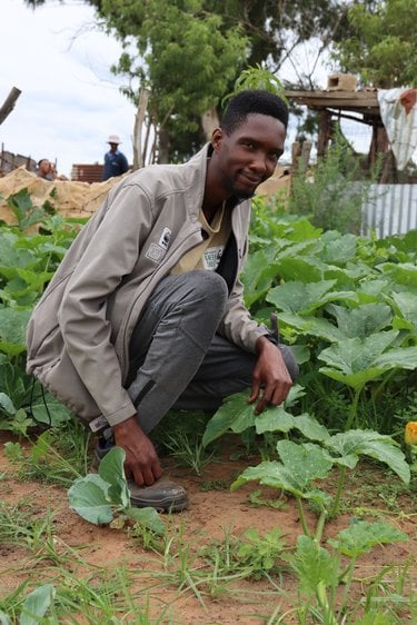 Tukulo “TK” Mtshayelo inside his garden
