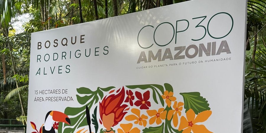 A sign displaying the name of the COP30 climate conference
