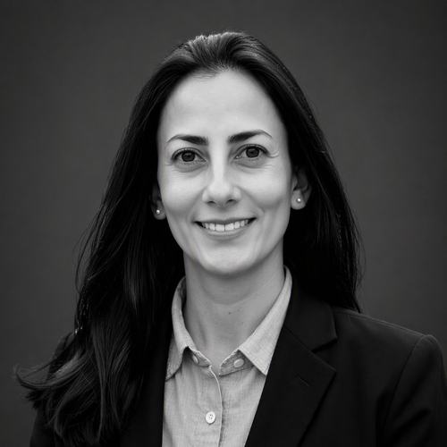 A headshot of a smiling woman
