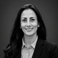 A headshot of a smiling woman