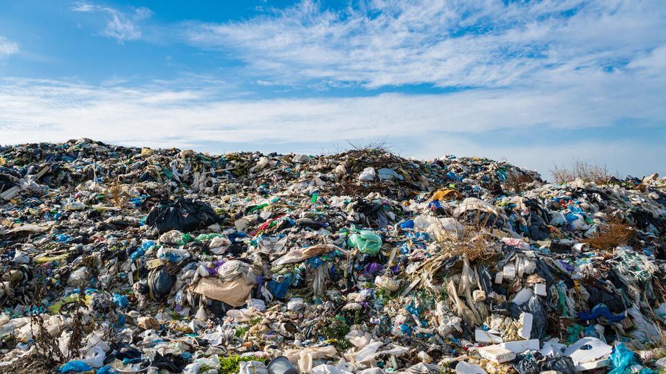 A large mound of trash, composed largely of plastic