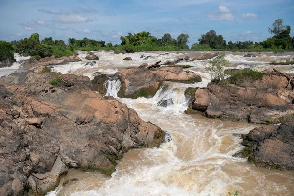 small waterfall running through rocks