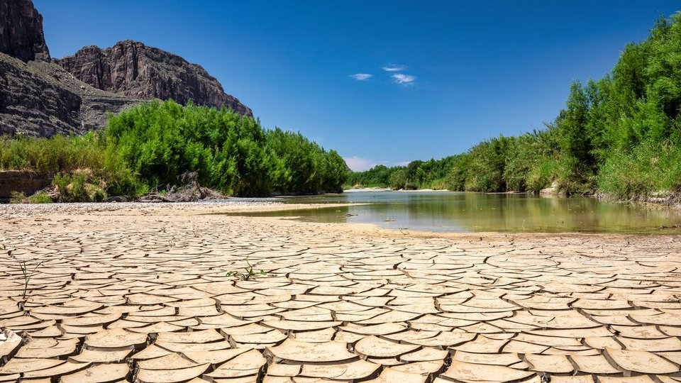 Cracked, drought-ridden soil makes up the bank of a portion of the Rio Grande-Rio Bravo