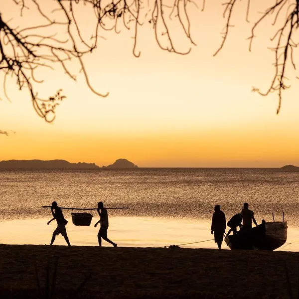 Fishers unload their catch at dusk in Ampasindava. Nosy Hara, Madagascar