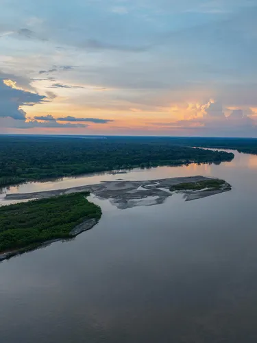 An aerial view of the sunset on Sunset on the Guaviare River in San José del Guaviare, Guaviare, Colombia