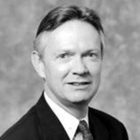 A black and white headshot of William T. Lake