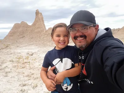 Selfie of Nick and Kai with rocks in background