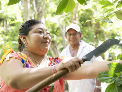 Rosa Cuxin Padilla and Francisco Canul Poot oversee the garden at the Yaxunah Community Center in Yucatan, Mexico