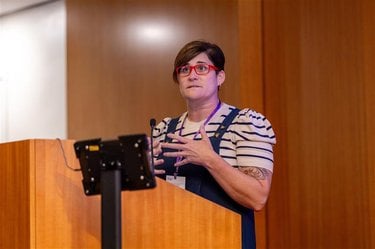 Erisn Simon speaking at a podium