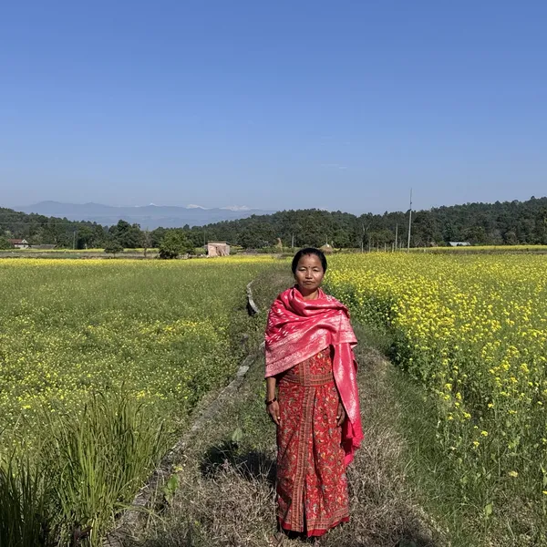 Purna-Devi-Magar-stands-proudly-in-her-mustard-field-fed-by-multipurpose-pond-in-Magar-Village-Rajpur-RM