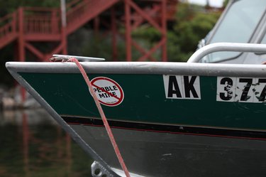 Prow of boat with sticker against Pebble Mine