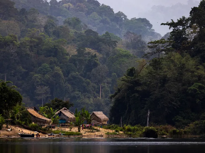 A village of thatched-roofs on the water's edge