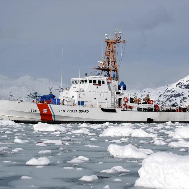 United States Coast Guard cutter Anacapa sails through icey waters in Glacier Bay, Alaska.