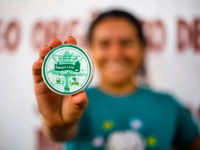Woman holding final product to camera