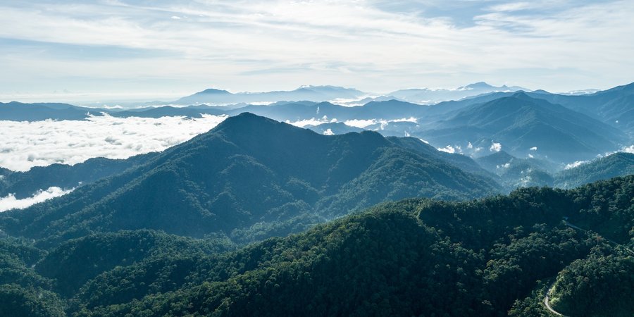 A view of mountains and clouds from above