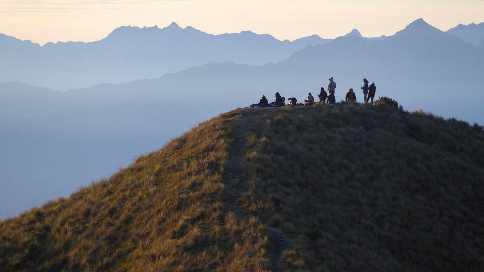 Community members gather on a hilltop in Mirador de Tres Cruces, Paucartambo, Manu National Park and Reserve, Peru