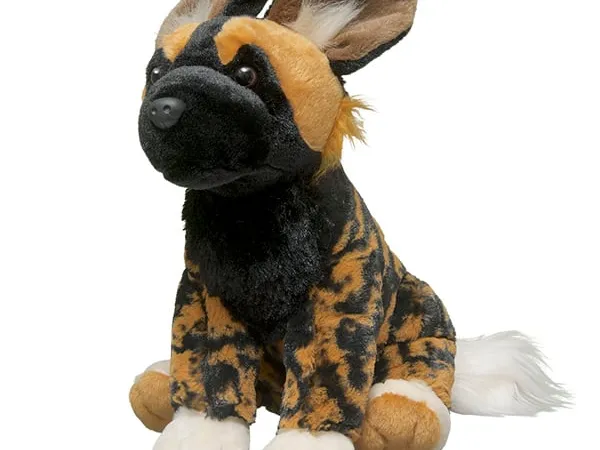 An African wild dog plush against a white background
