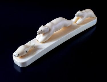 A walrus ivory carving showing polar bears