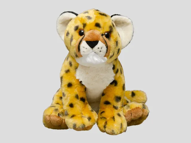 A cheetah plush against a gray background