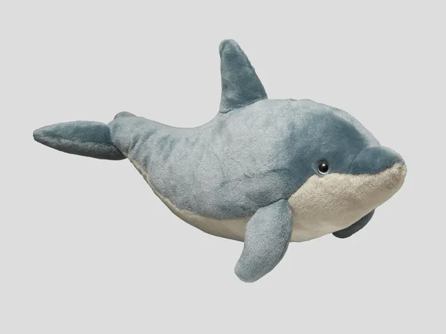 A dolphin plush against a white background
