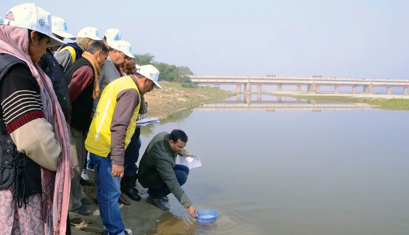 Volunteers observing and testing river