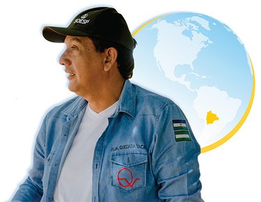 Man with globe showing Bolivia