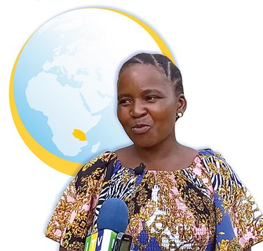 Woman with globe highlighting Tanzania