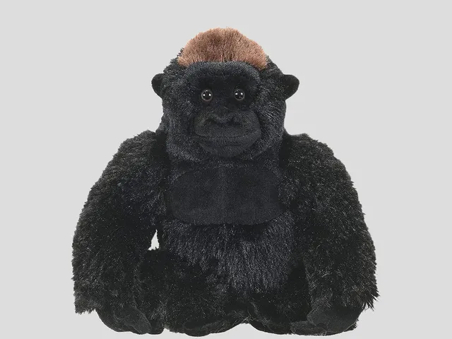 A gorilla plush against a gray background