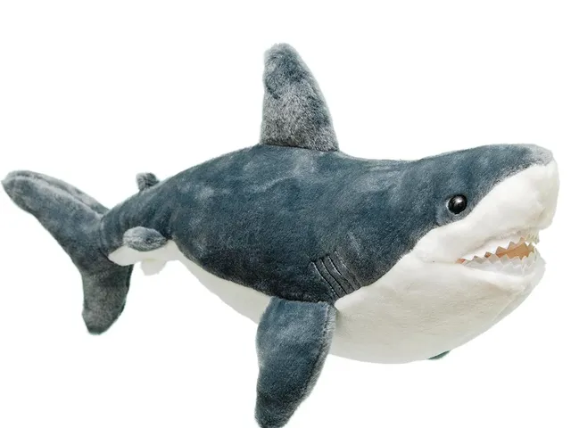 A great white shark plush against a white background